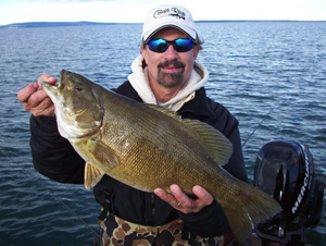 Joe Puccio with a monster smallie caught in Chequamegon Bay using Odd' Ball Jigs tipped with a Redtail chubs or craw combos.